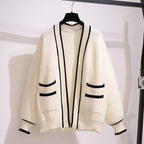 Womens Sleeveless Knit Dress Cardigan Two Piece Set white cardigan with black trim hanging on hanger