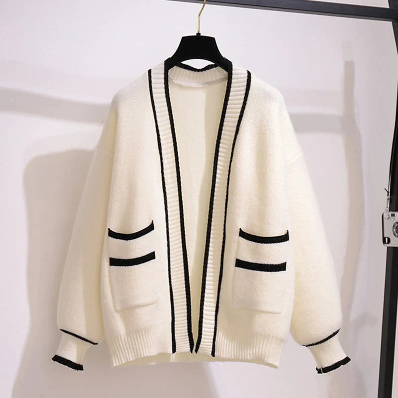 Womens Sleeveless Knit Dress Cardigan Two Piece Set white cardigan with black trim hanging on hanger