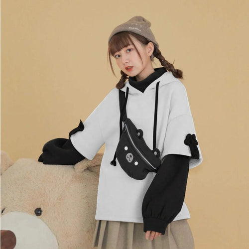 Young woman wearing kawaii bear anime Crewneck Long Sleeve hoodie in white and black with bear face bag