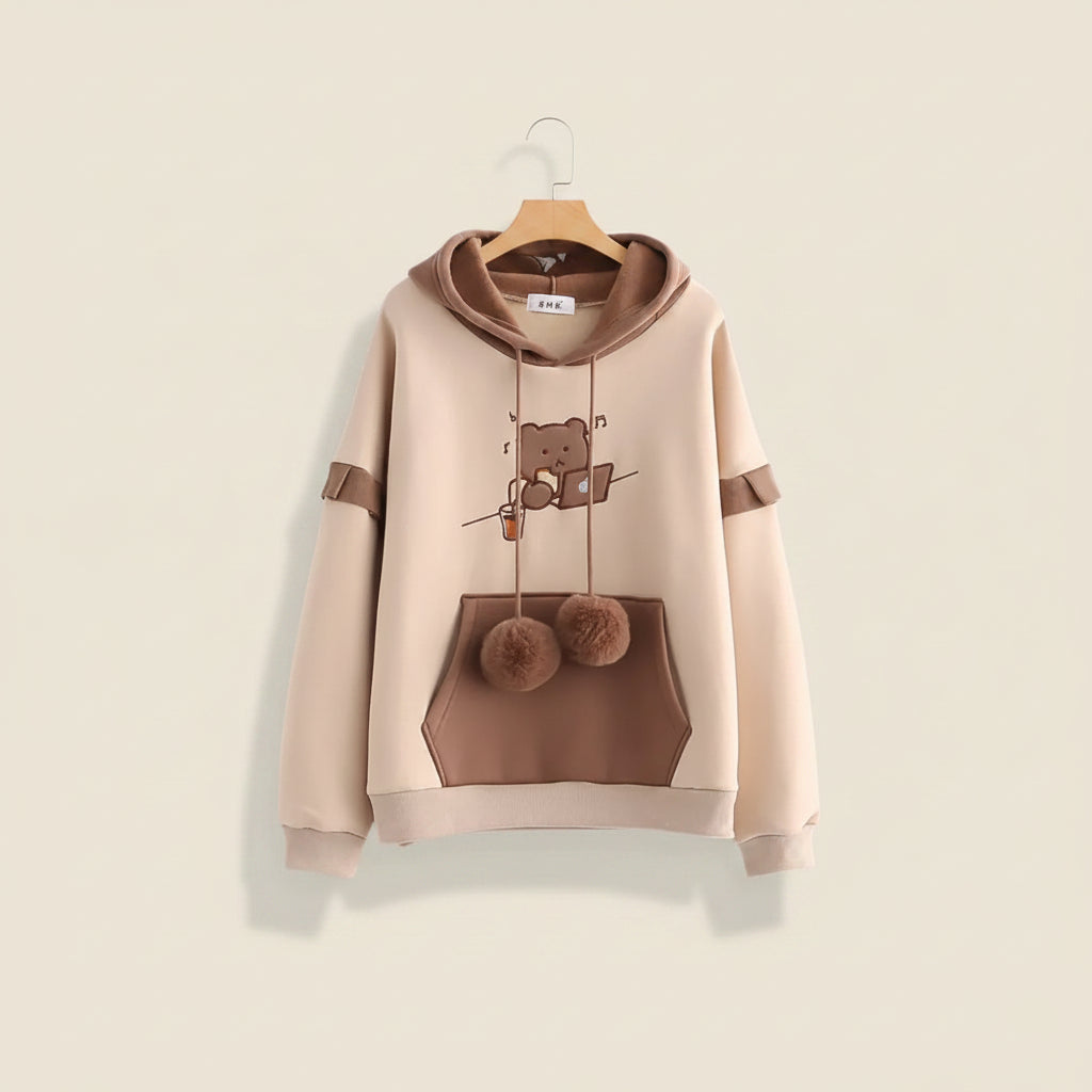 Kawaii bear japanese hoodie for women in beige and brown with bear graphic and pom pom drawstrings