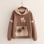 Kawaii bear Japanese hoodie for women in brown with beige details and pompom drawstrings
