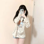 Kawaii cartoon long sleeve t shirt with cute animal design worn by a girl taking a mirror selfie