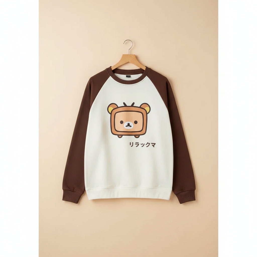 Japanese kawaii pullover top with brown sleeves and a cute bear TV character on front