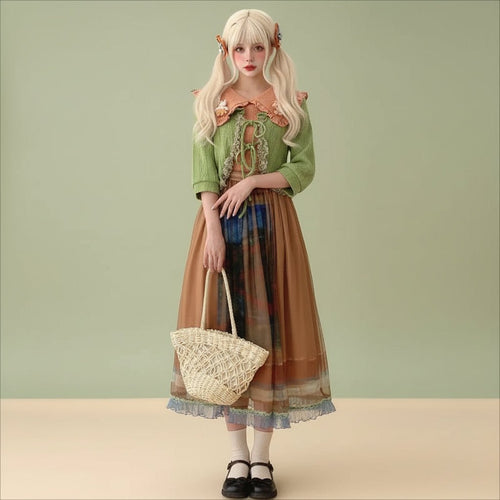 Woman wearing a green kawaii lolita cardigan for women tied at the front with a layered brown skirt and accessories