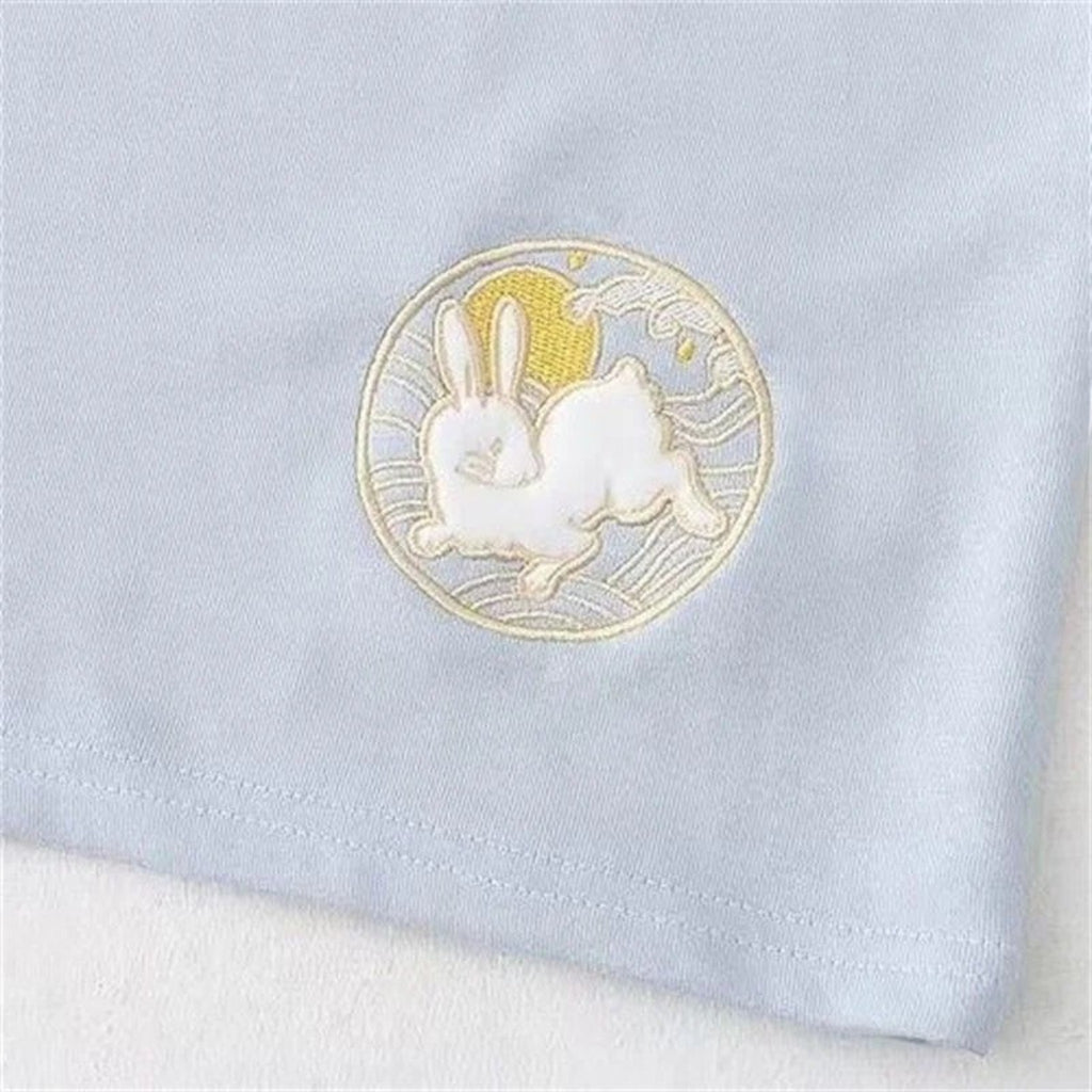 Close-up of kawaii loose long sleeve spring hoodie with embroidered white bunny and yellow sun design