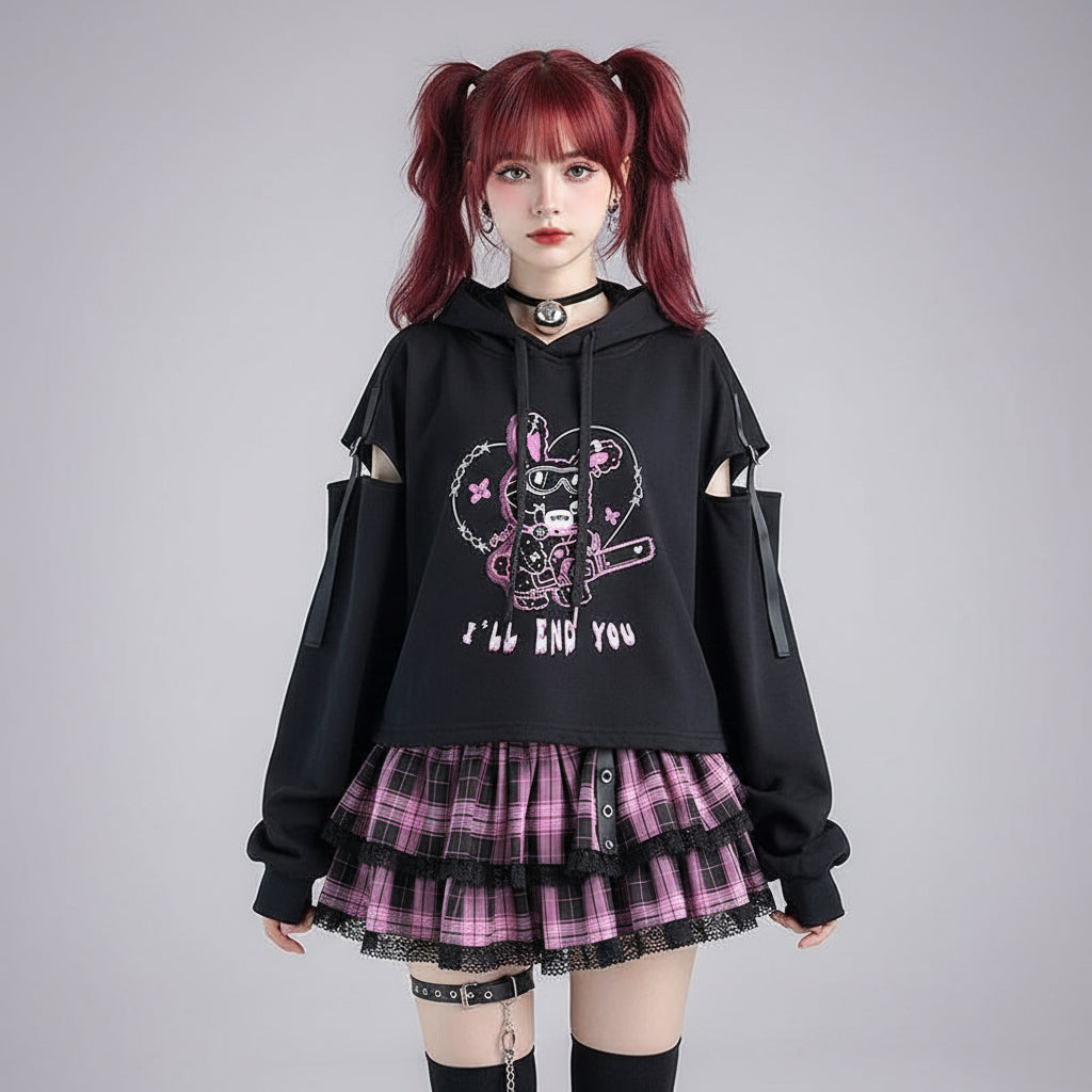 Black kawaii preppy patchwork crop hoodie with cut-out sleeves and pink graphic design paired with pink plaid skirt
