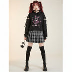 Kawaii preppy patchwork crop hoodie in black with cute graphic and cut-out sleeves worn with plaid skirt