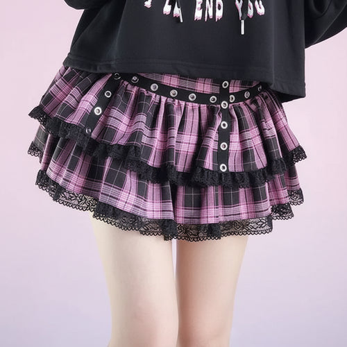 Woman wearing a kawaii preppy patchwork crop hoodie with a pink plaid layered skirt featuring black lace trim