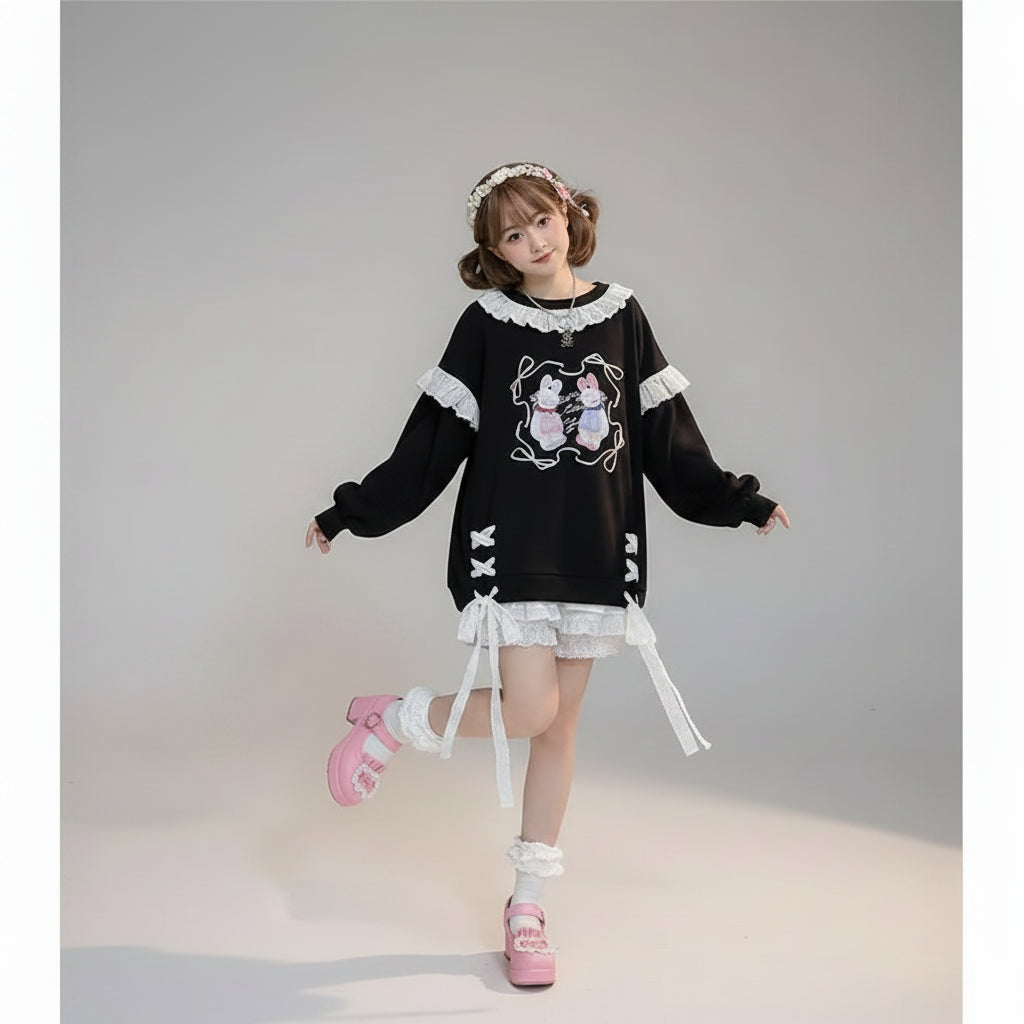 Woman wearing kawaii print casual O-neck sweatshirt with bunny design and lace details in a cozy room