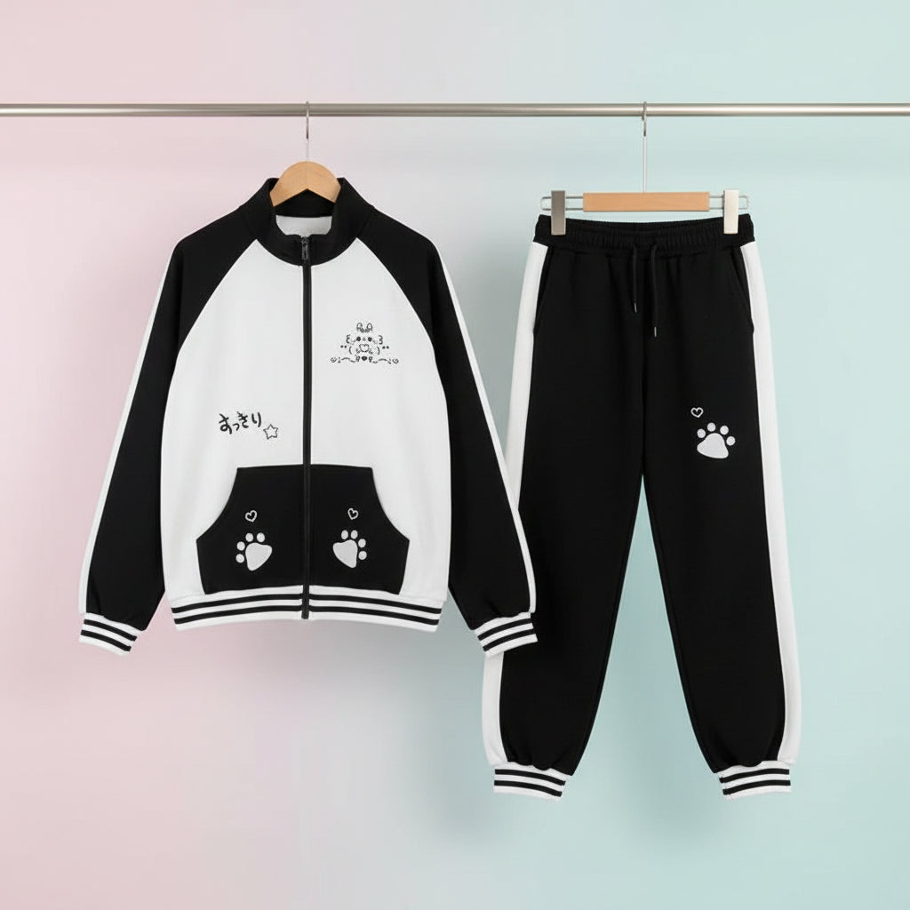 Black and white japanese cartoon hoodie and pants set with paw prints and cute cartoon designs