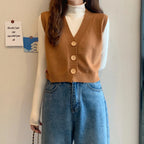 Korean fashion crop knit top in brown with button details, styled over a white long-sleeve shirt