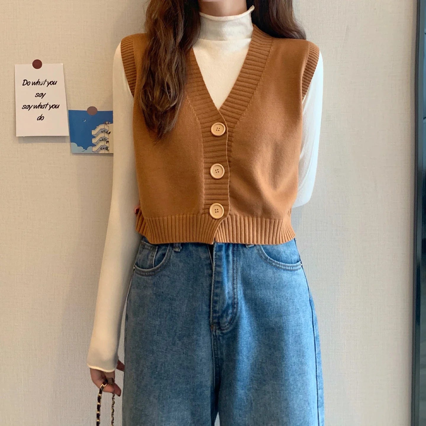 Korean fashion crop knit top in brown with button details, styled over a white long-sleeve shirt
