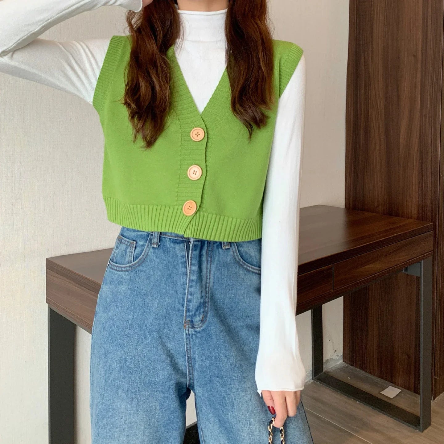 Korean fashion crop knit top in green with buttons, styled over a long sleeve shirt