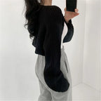 Korean knitted short cardigan in black, paired with a white top and gray sweatpants