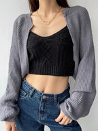 Korean knitted short cardigan in gray paired with a black cropped top and high-waisted jeans