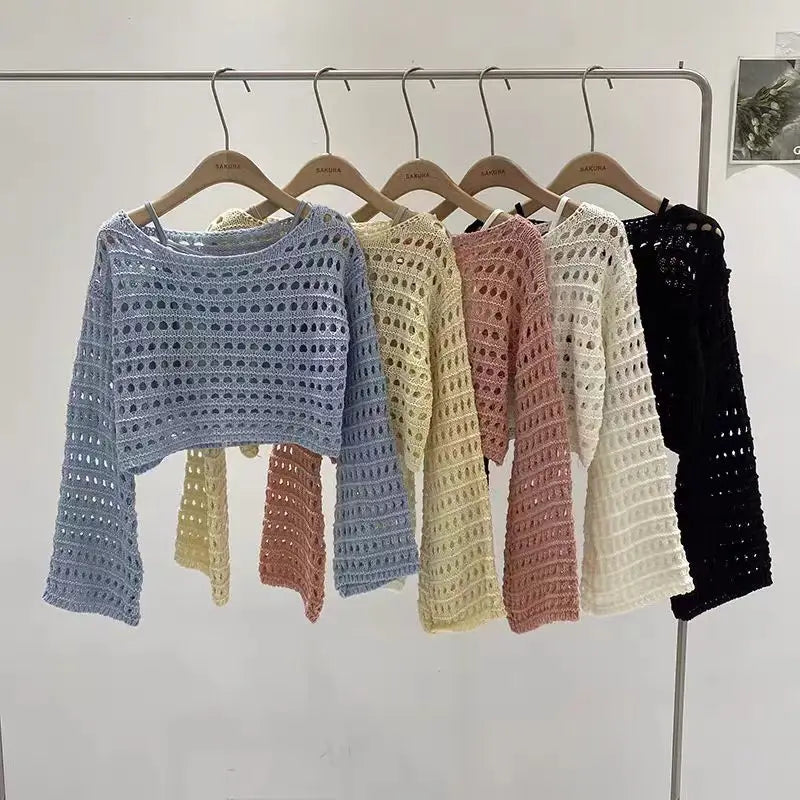 Korean streetwear crochet top collection in pastel colors hanging on a display rack