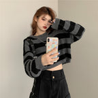 Young woman taking selfie wearing Korean striped knit sweater with black and gray wide stripes