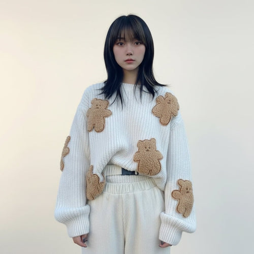 Woman wearing a white Korean style loose bear jumper with brown plush bear patches outdoors