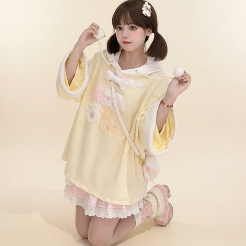 Cute young woman wearing a yellow japanese style casual drawstring hoodie with playful details and white lining