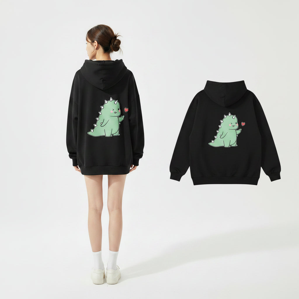 Black matching couple hoodies with cartoon design featuring a cute green dinosaur and heart graphic