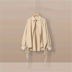 Light beige khaki blouse with side tie ribbons on hanger