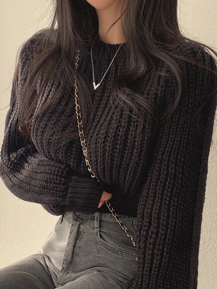 Stylish loose vintage Korean knit sweater in black, perfect for a cozy yet chic look