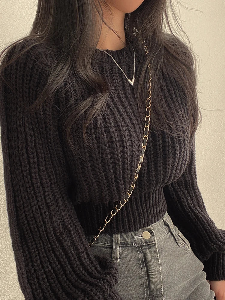 Loose vintage Korean knit sweater in black with ribbed cuffs and hem for a cozy look