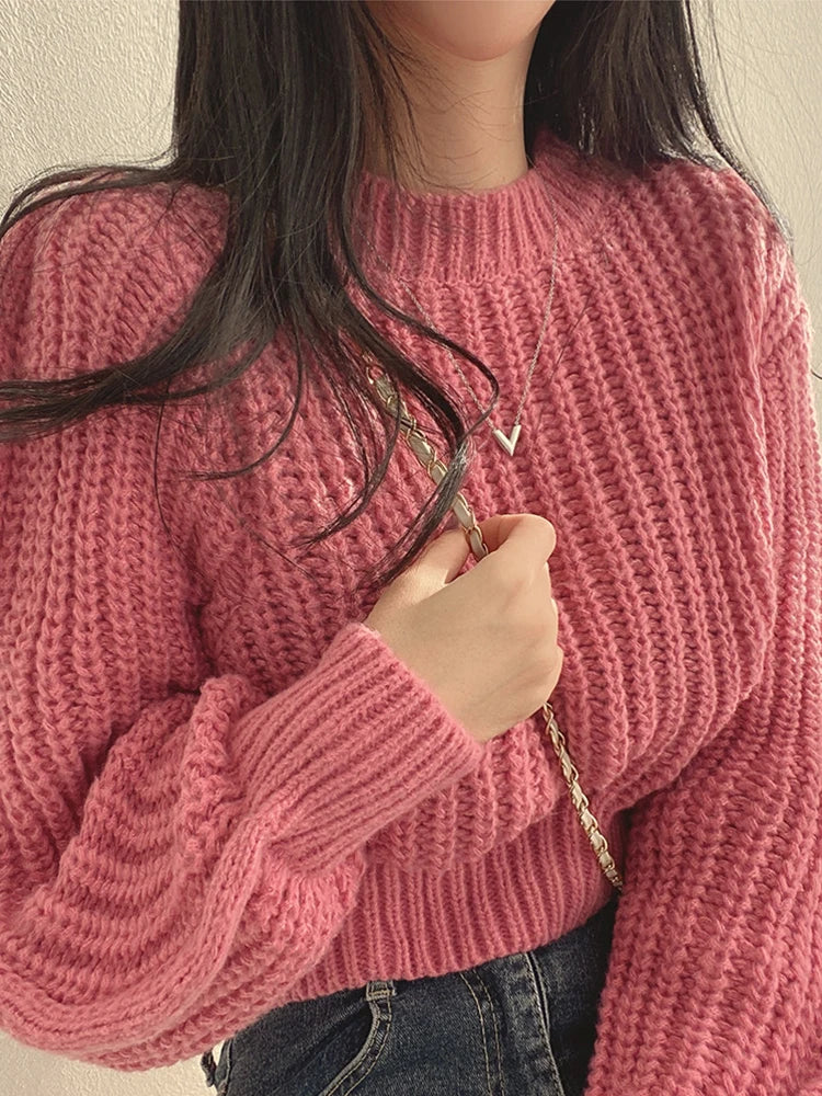 Loose vintage Korean knit sweater in pink with a cozy ribbed texture, perfect for casual styling