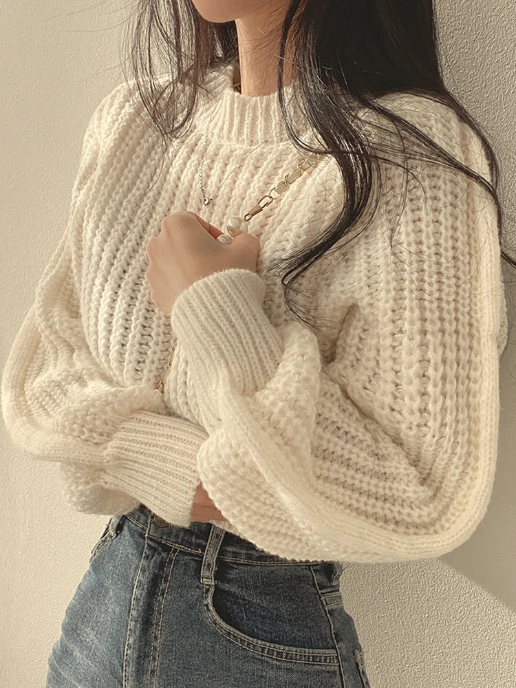 Loose vintage Korean knit sweater in cream color, featuring a relaxed fit and textured design