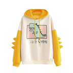 Kawaii dinosaur sweatshirt with yellow sleeves and hood featuring a cute green dinosaur graphic