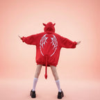 Trendy anime streetwear hoodie in red with dragon wings design and devil tail on the back