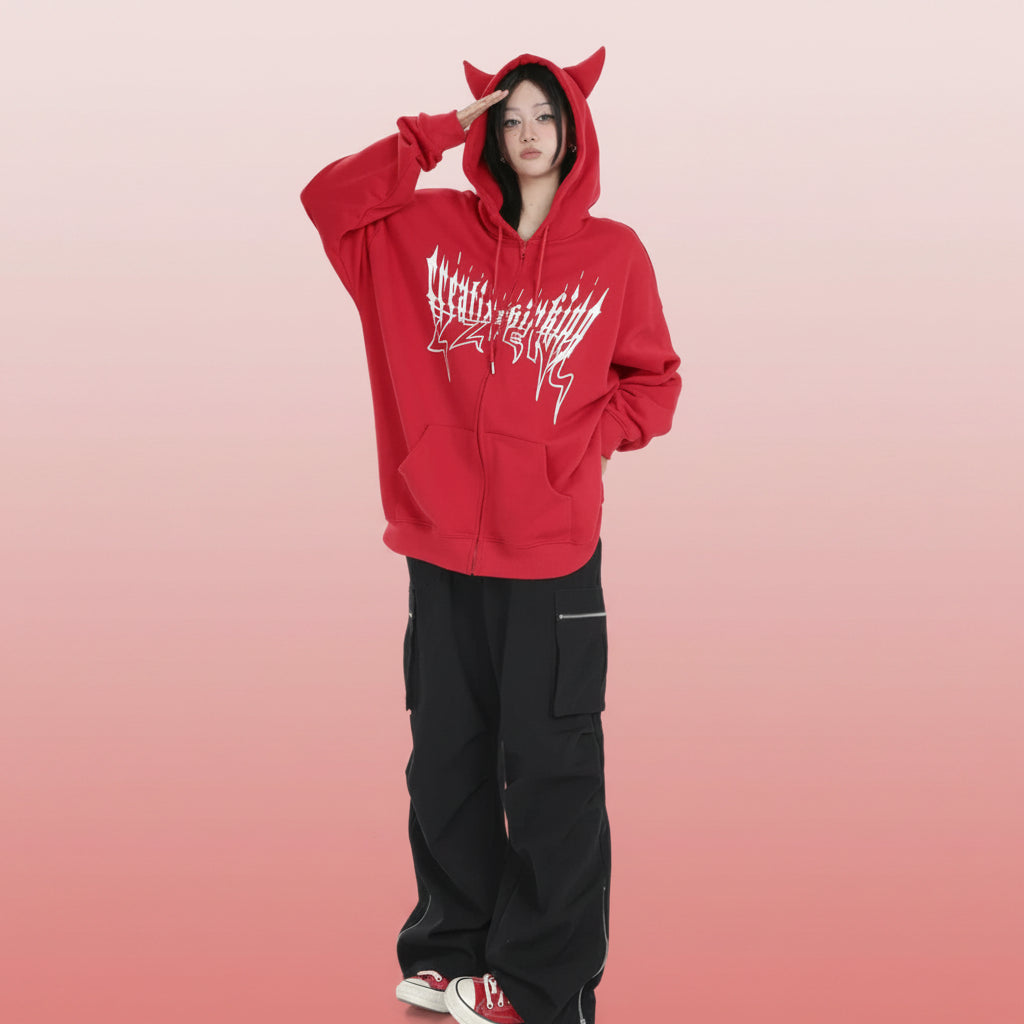 Trendy anime streetwear hoodie in red with cat ears and white graphic design worn by model