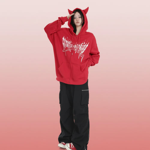 Trendy anime streetwear hoodie in red with cat ears and white graphic design worn by model