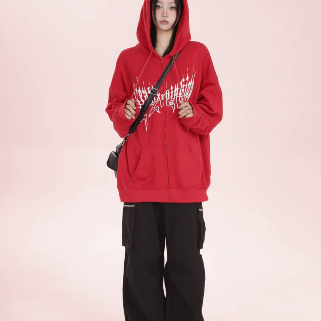 Trendy anime streetwear hoodie in red with white graphic design worn with black cargo pants