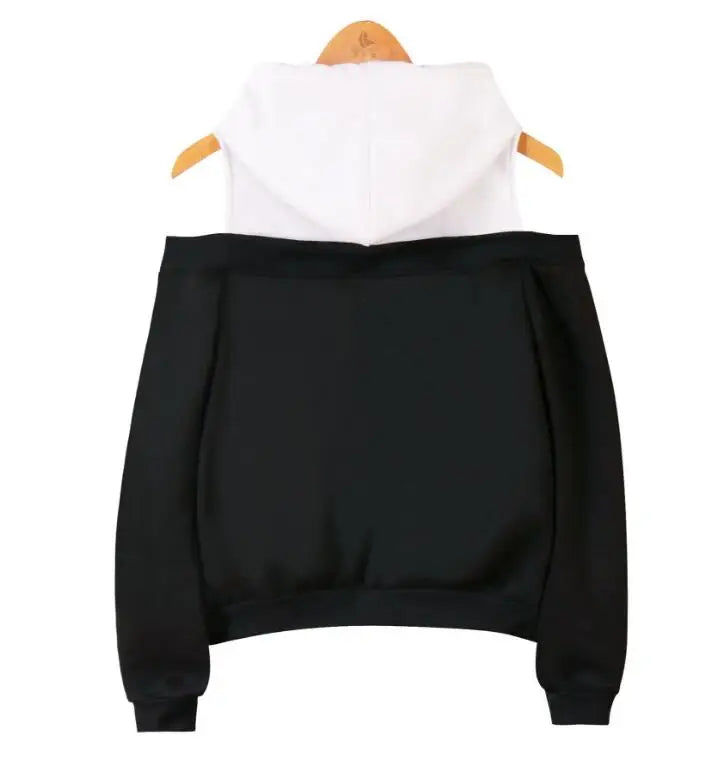 Black and white strapless hooded sweatshirt for women hanging on wooden hanger