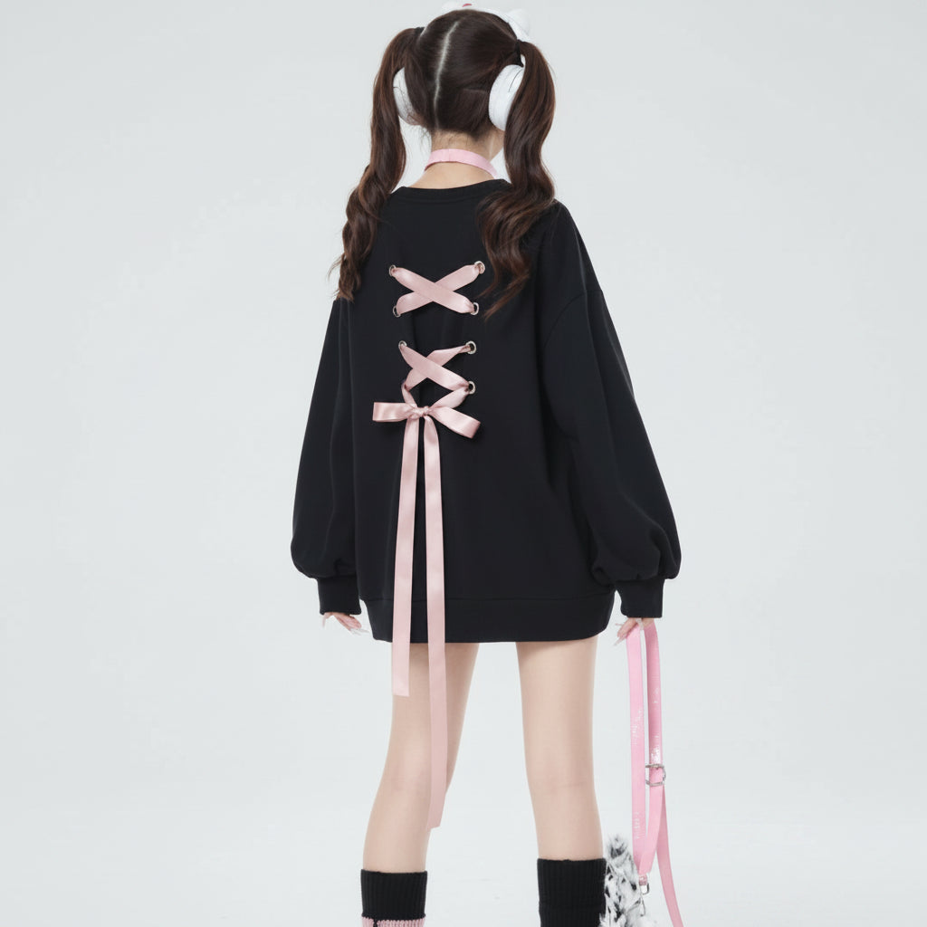 Back view of sweet ribbon hoodie japanese style with pink ribbon lacing on black oversized hoodie