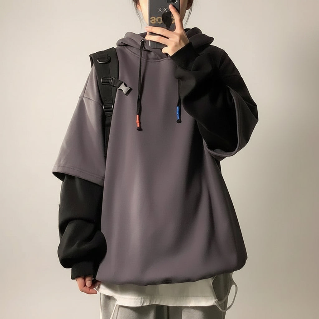 Autumn winter unisex casual pullover with layered sleeve design in purple and black worn with grey pants