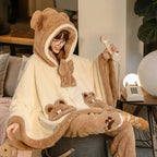 Cozy japanese kawaii bear ear pajama outfit with hood and plush details worn by woman sitting on couch