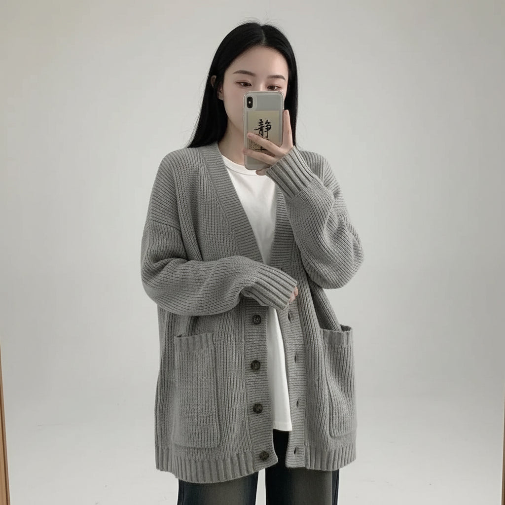 Cozy gray V-neck pullover sweater for women with button closures and front pockets
