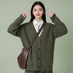 Cozy green V-neck pullover sweater for women with button-down and pockets for casual style