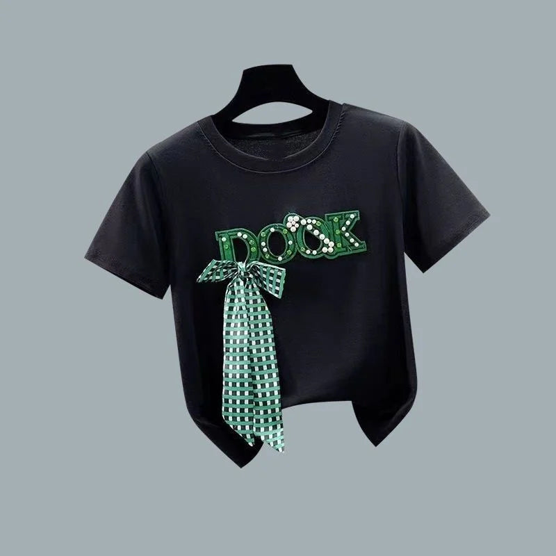 Black bowknot t shirt with green letter design and attached checkered bow detail from Vusy Kawai Shop