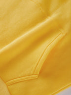 Close-up of yellow casual kawaii hoodie for women showing pocket and stitching details