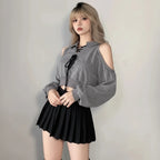 Young woman wearing a cute Korean style streetwear top with cold shoulder and lace-up front in gray