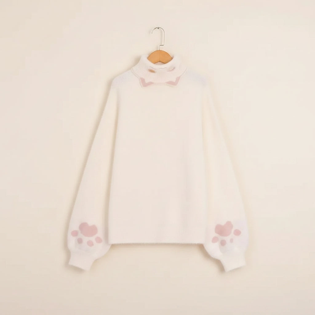 Creamy white japanese cartoon cat pullover for women with pink paw prints on sleeves and high neck