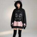 Black hoodie with japanese cartoon print women sweatshirt featuring cat ears hood and pink paw design