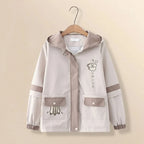 Japanese cute hooded jacket for women in beige with cartoon prints and button pockets