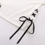 Close-up of white japanese soft girlcat style hoodie with black ribbon lace-up detail