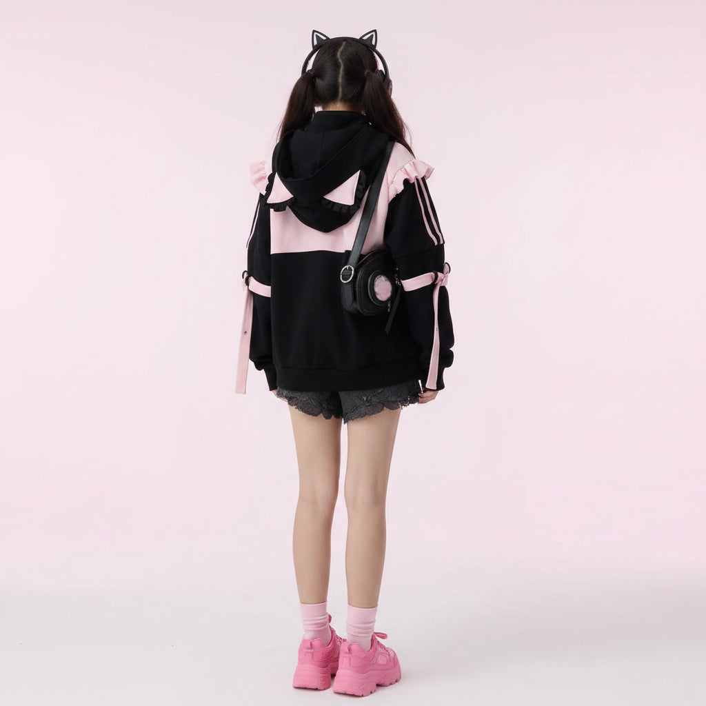 Black and pink kawaii cat ear hoodie for women with ears worn with black shorts and accessories