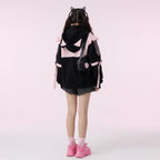 Black and pink kawaii cat ear hoodie for women with ears worn with black shorts and accessories