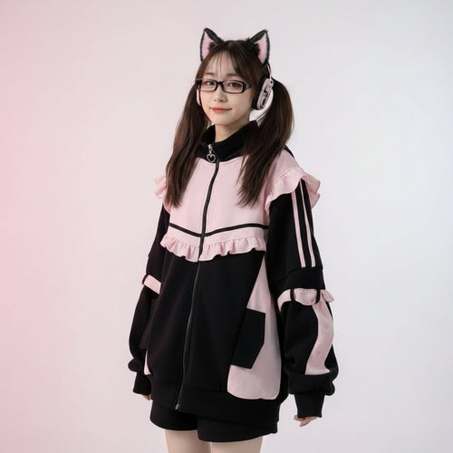 Woman wearing kawaii cat ear hoodie for women with ears in black and pink sitting outdoors